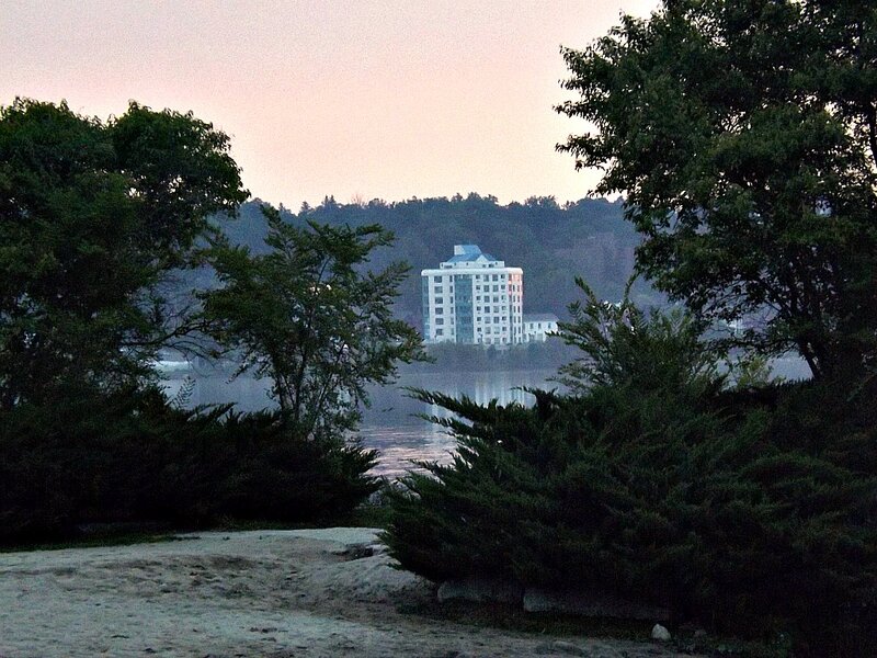 White Building by Lake — Green