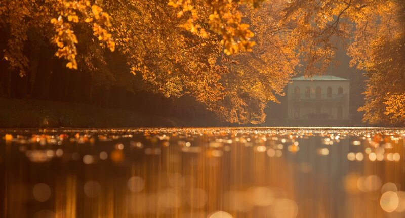 White Building by Lake — Orange