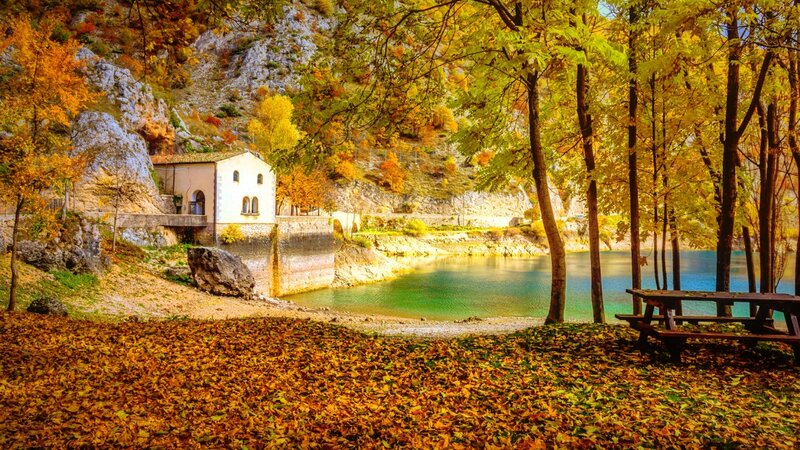 White Building by Lake — Yellow