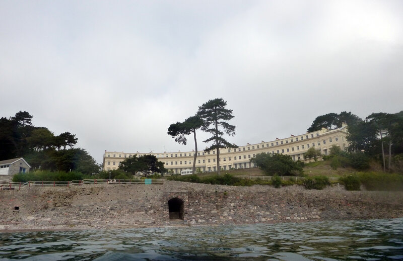 White Building on Hillside — Gray
