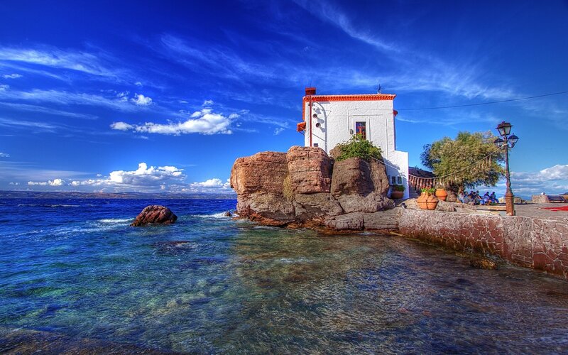 White Building on Rocks — Blue, Serene