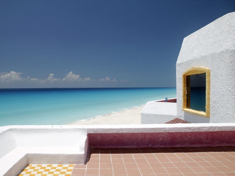 White Building Overlooking Beach