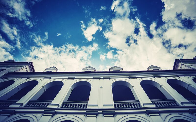 White Building with Arches — Blue, Dramatic
