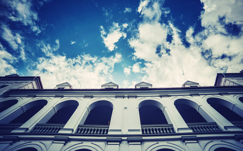 White Building with Arches — Blue