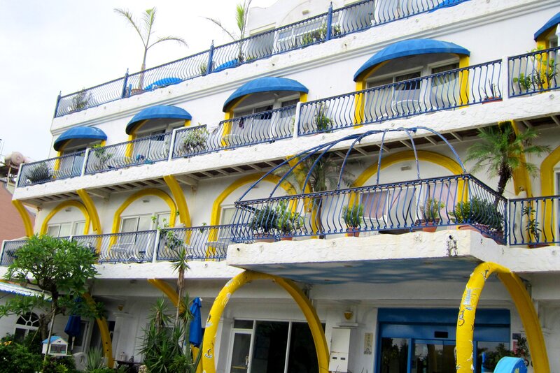 White Building with Blue and Yellow Accents