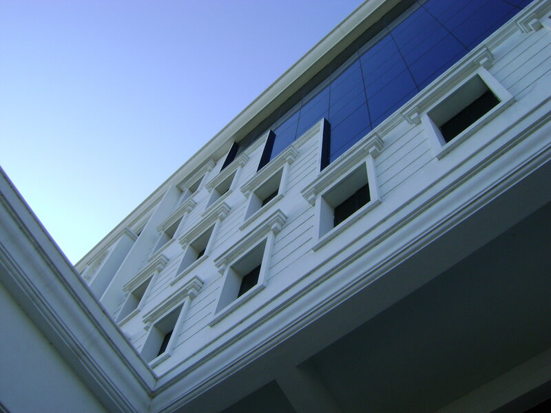 white building with blue glass
