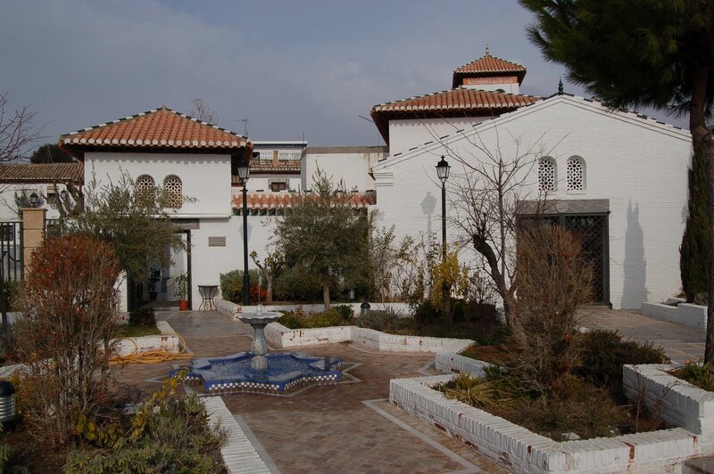 white building with courtyard fountain