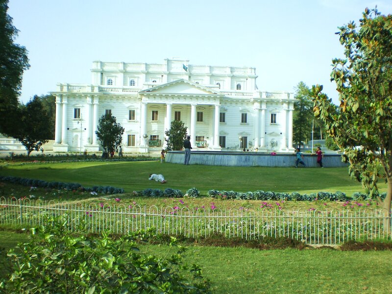 White building with garden