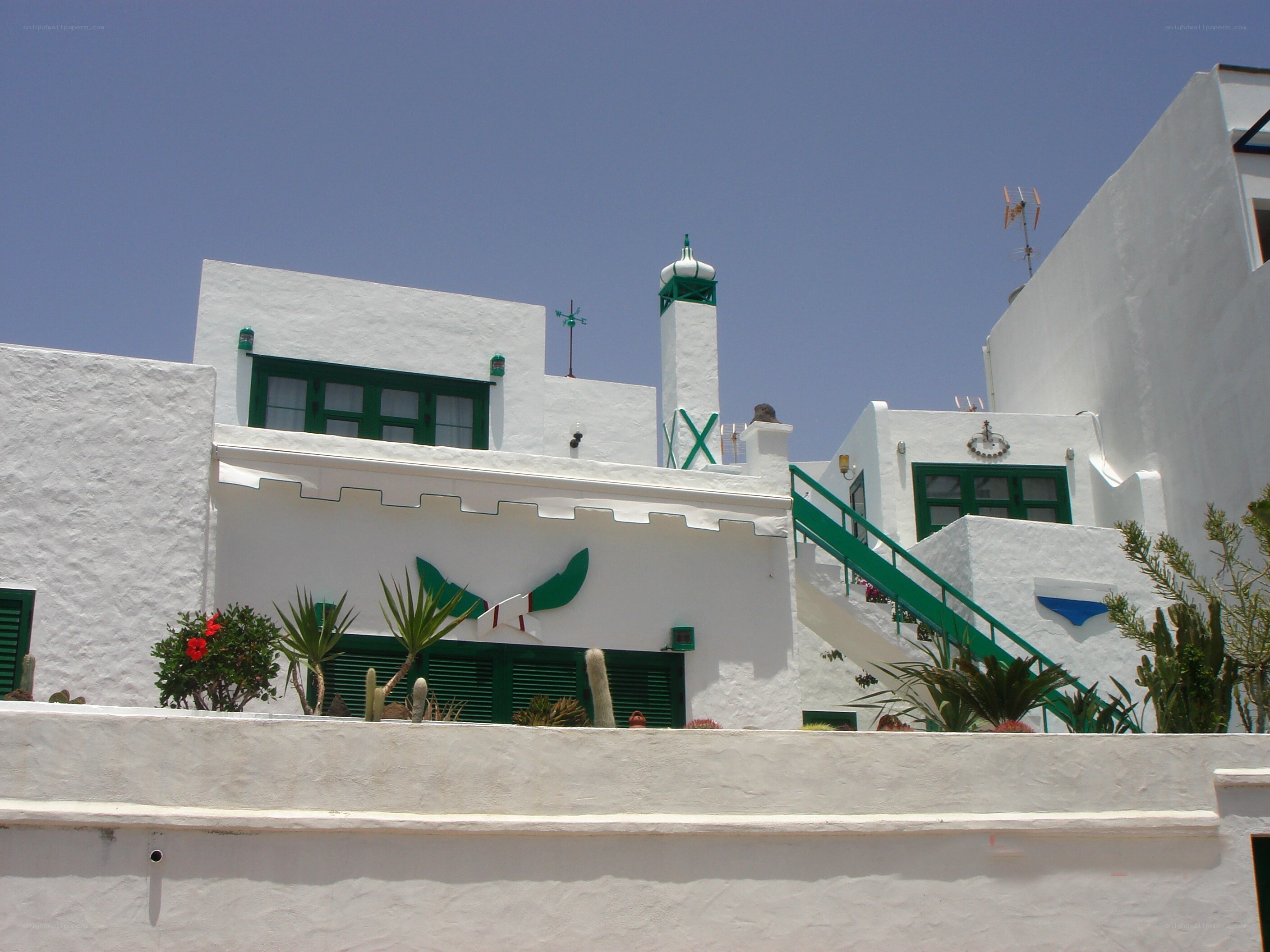 White building with green accents