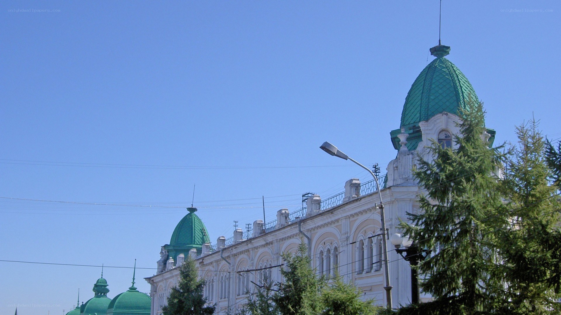 white building with green domes