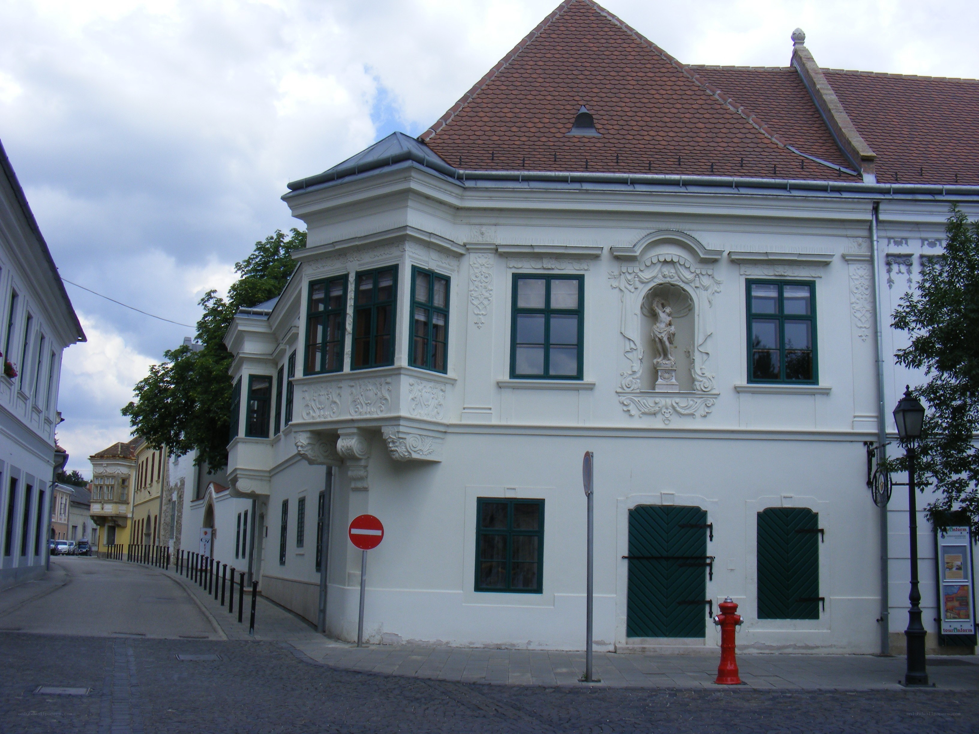 white building with green shutters