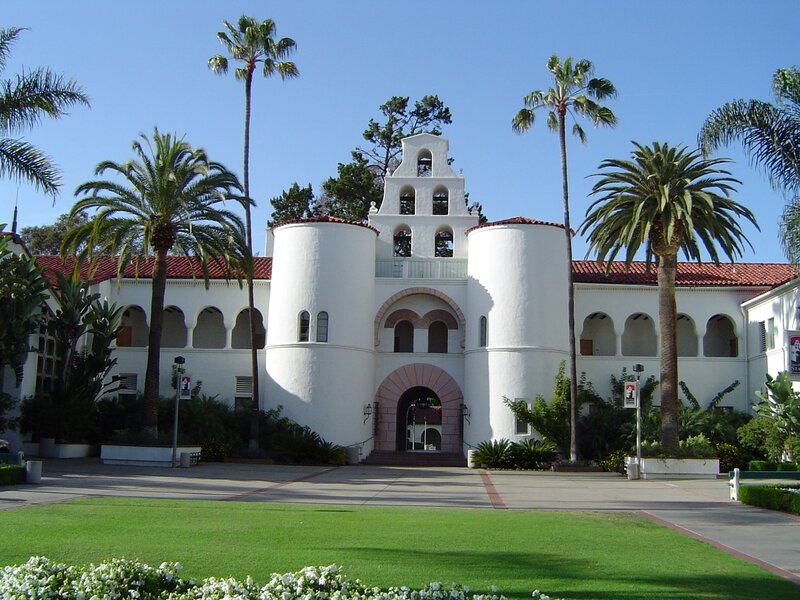 white building with palm trees