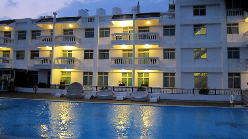 White Building with Pool — Blue