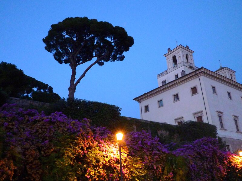 White Building with Purple Flowers