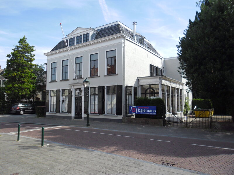 White Building with Sign