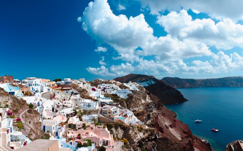 White Buildings on Cliff — Blue, Dramatic, Afternoon