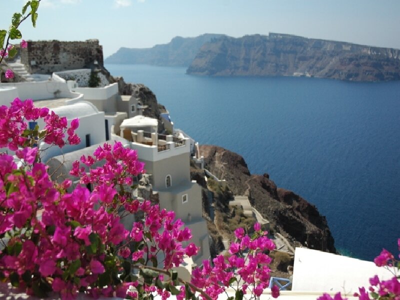 White Buildings on Cliff — Blue, Serene, Afternoon, Photograph, Flowers