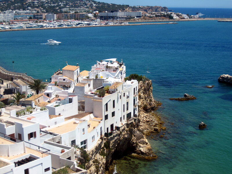 White Buildings on Cliff — Blue, Serene, Afternoon, Photograph, Sea