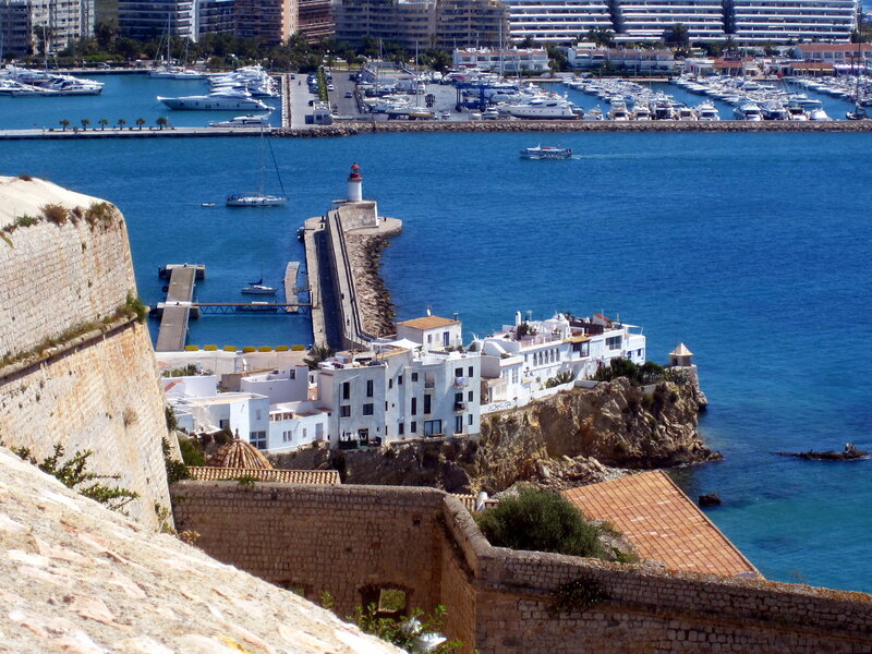 White Buildings on Cliff — Blue, Serene, Afternoon