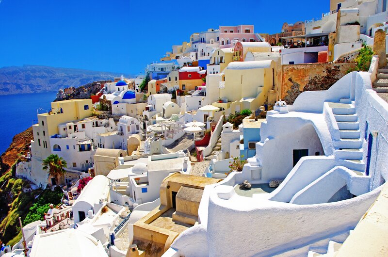 White Buildings on Cliff — Serene, Afternoon, Photograph, Blue Domes