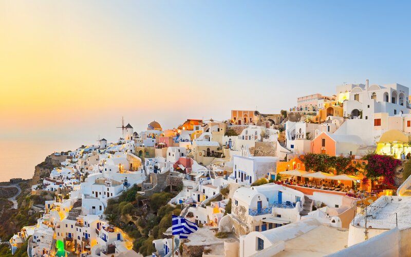 White Buildings on Cliff — Serene, Sunset, Photograph, Windmill, Greek Flag, Sea, Flowers