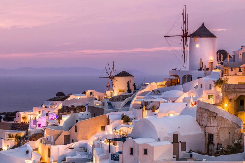 White Buildings on Cliff — Serene, Sunset, Photograph, Windmills, Sea
