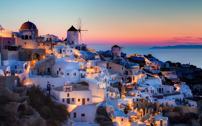 White Buildings on Cliff — Serene, Sunset, Photograph, Windmills