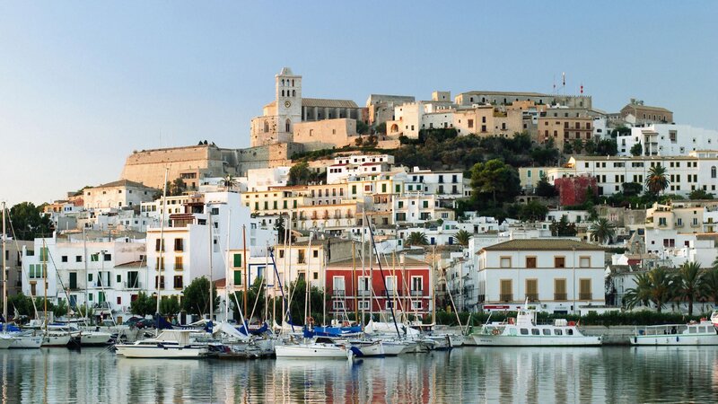 White Buildings on Hillside — Serene, Afternoon, Photograph, Boats