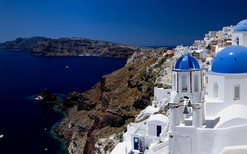 White Buildings with Blue Domes — Serene, Afternoon