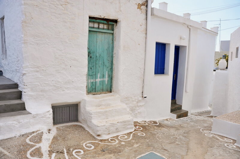 White buildings with colorful doors