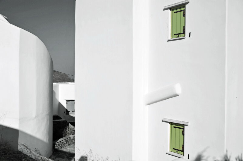 White buildings with green windows
