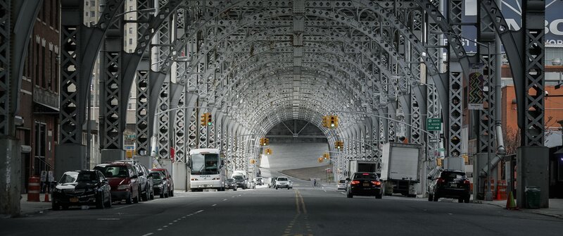 White Bus under Bridge