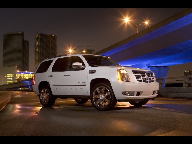 White Cadillac Escalade Hybrid at night