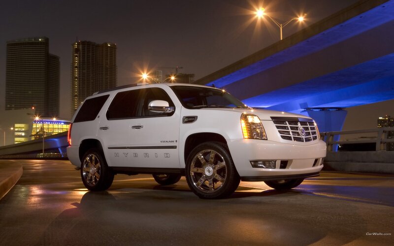 White Cadillac Escalade Hybrid at night