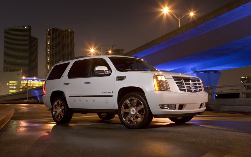 White Cadillac Escalade Hybrid at night