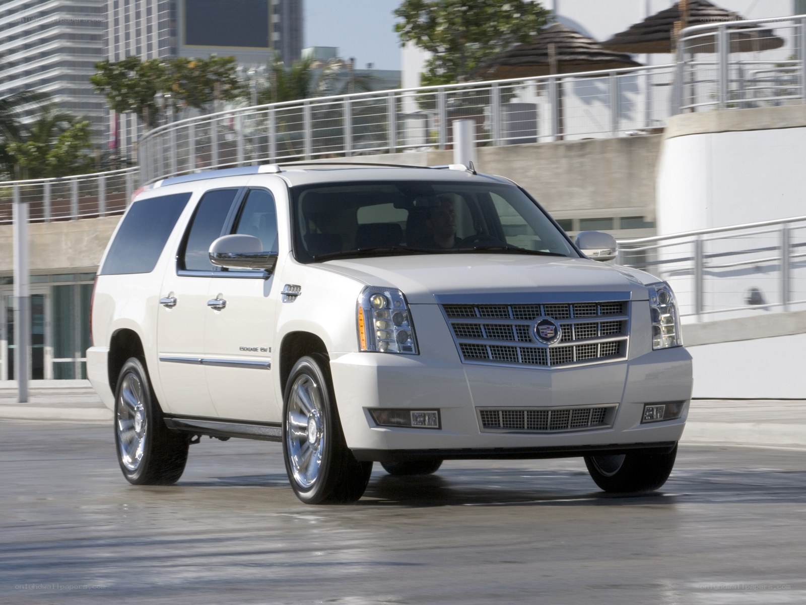 White Cadillac Escalade in motion