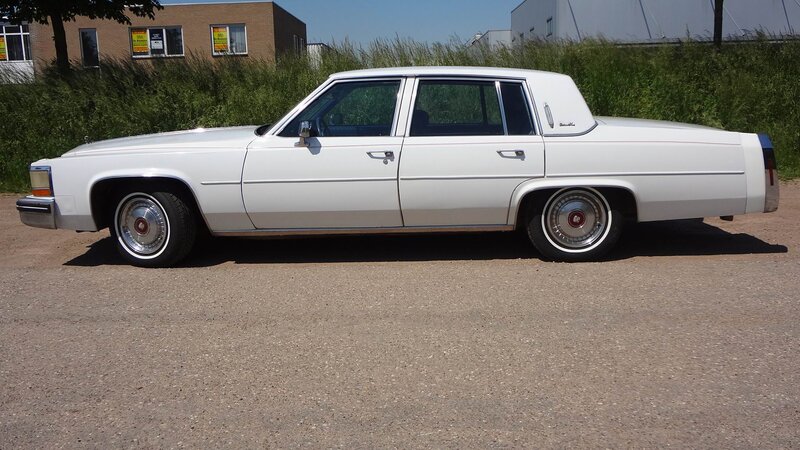 White Cadillac Sedan — Neutral, Afternoon