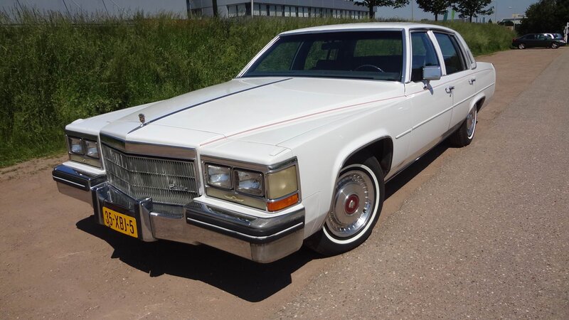 White Cadillac Sedan — Neutral