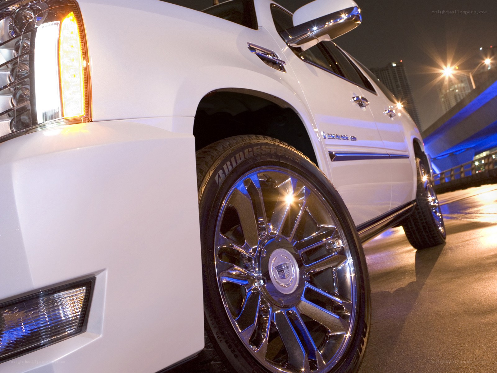 White Cadillac SUV at night