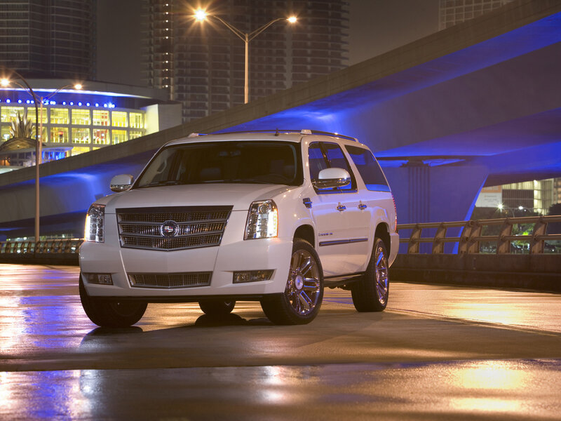White Cadillac Suv — Dramatic, Night, Photograph, City Buildings