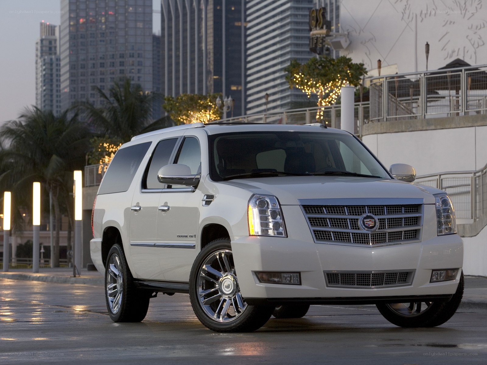 White Cadillac SUV in city