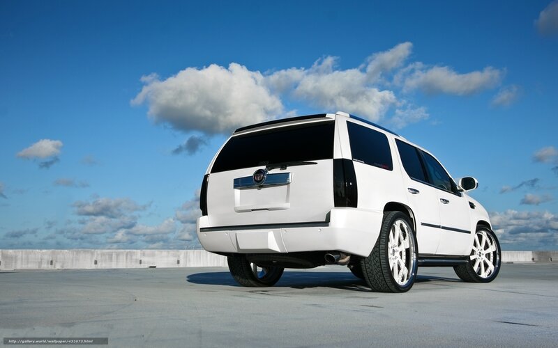 white cadillac suv on rooftop
