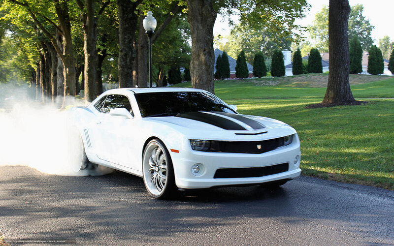 white camaro doing burnout