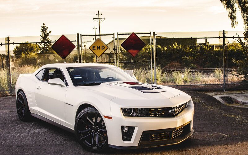White Camaro in industrial area