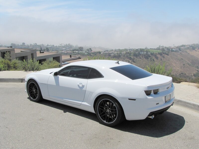 White Camaro on a hillside