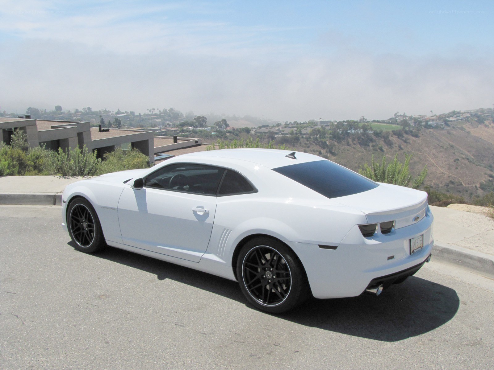 White Camaro on a hillside