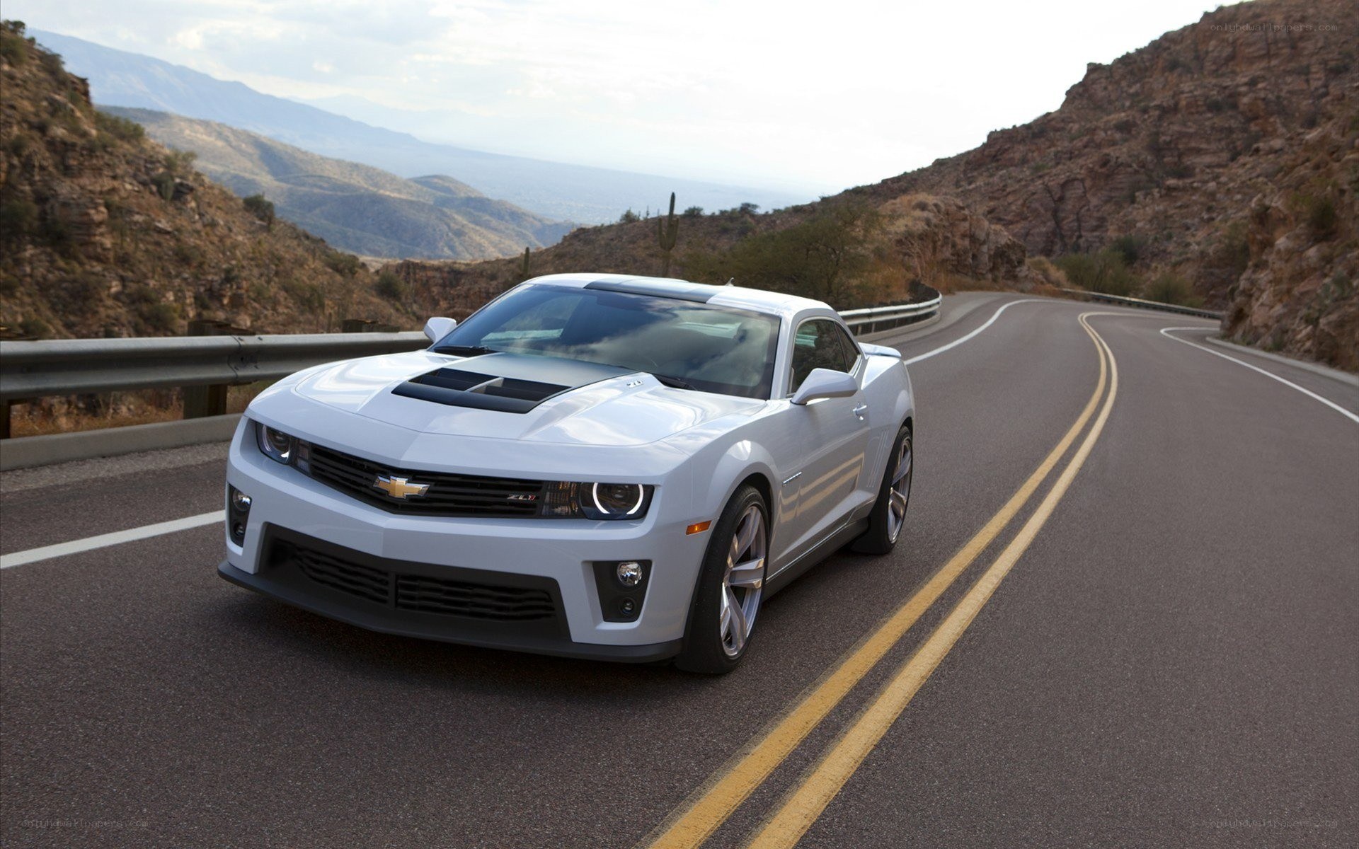 White Camaro on mountain road