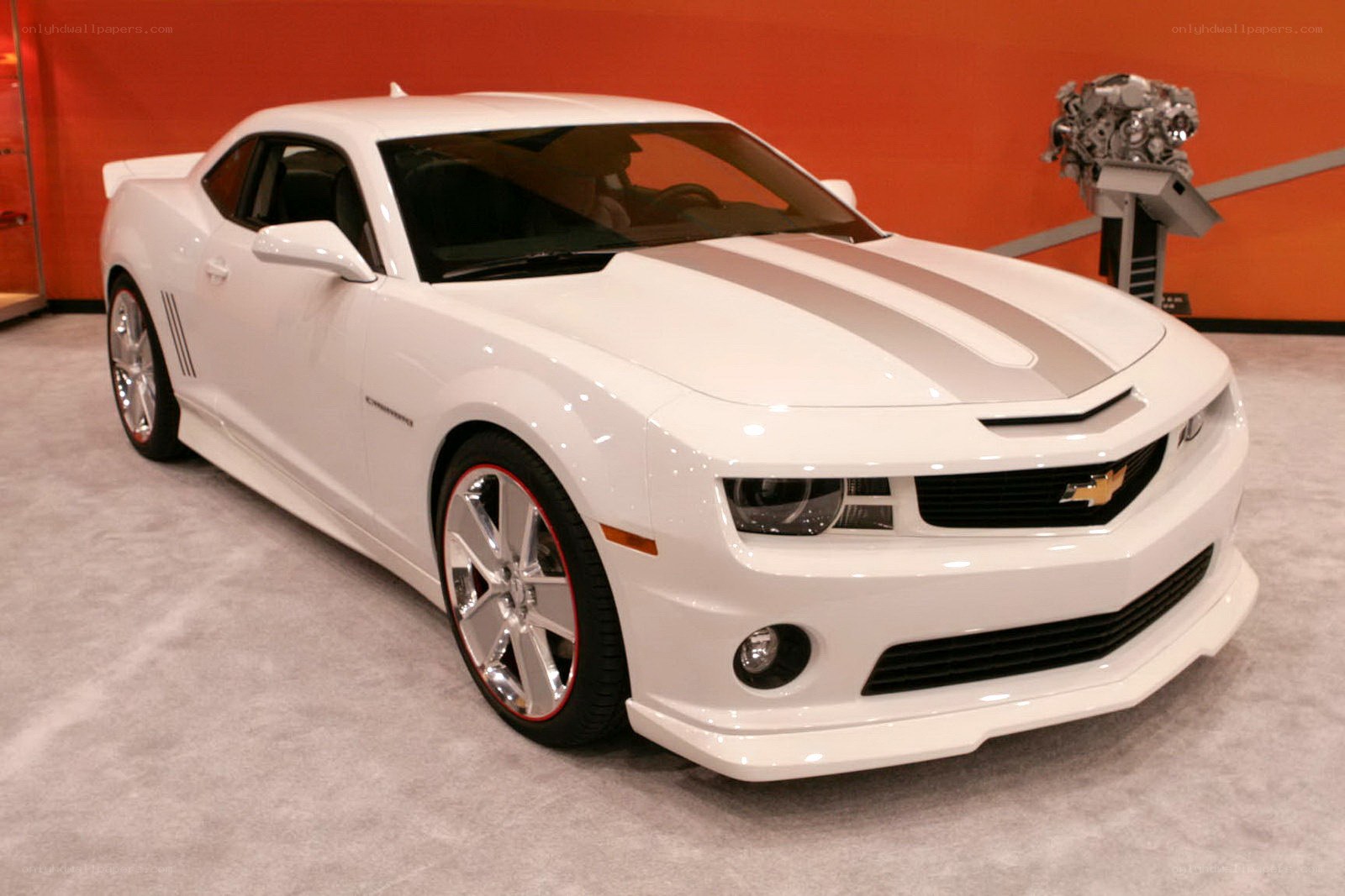 White Camaro with racing stripes