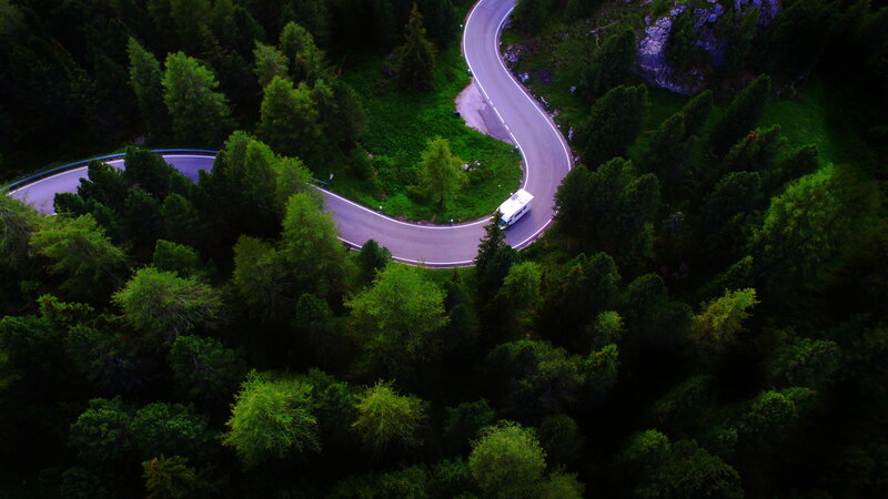 White Camper on Winding Road