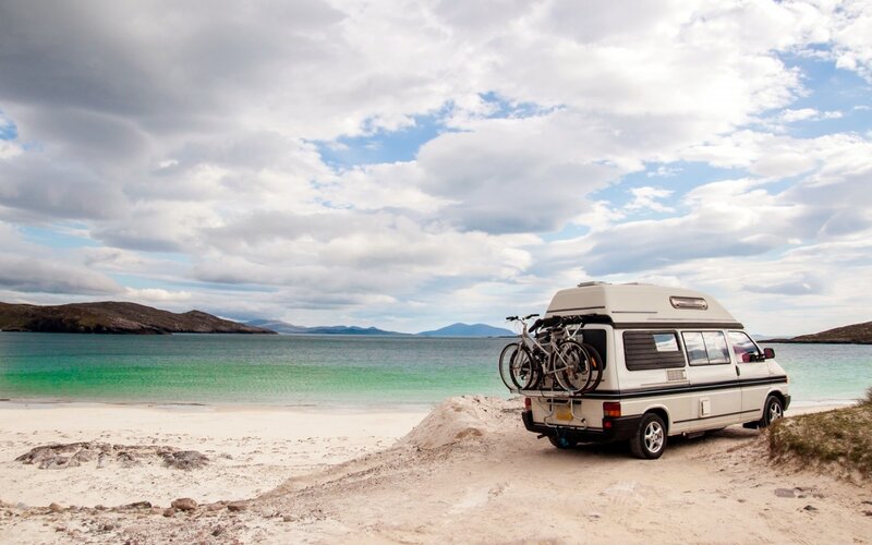 White Camper Van on Beach